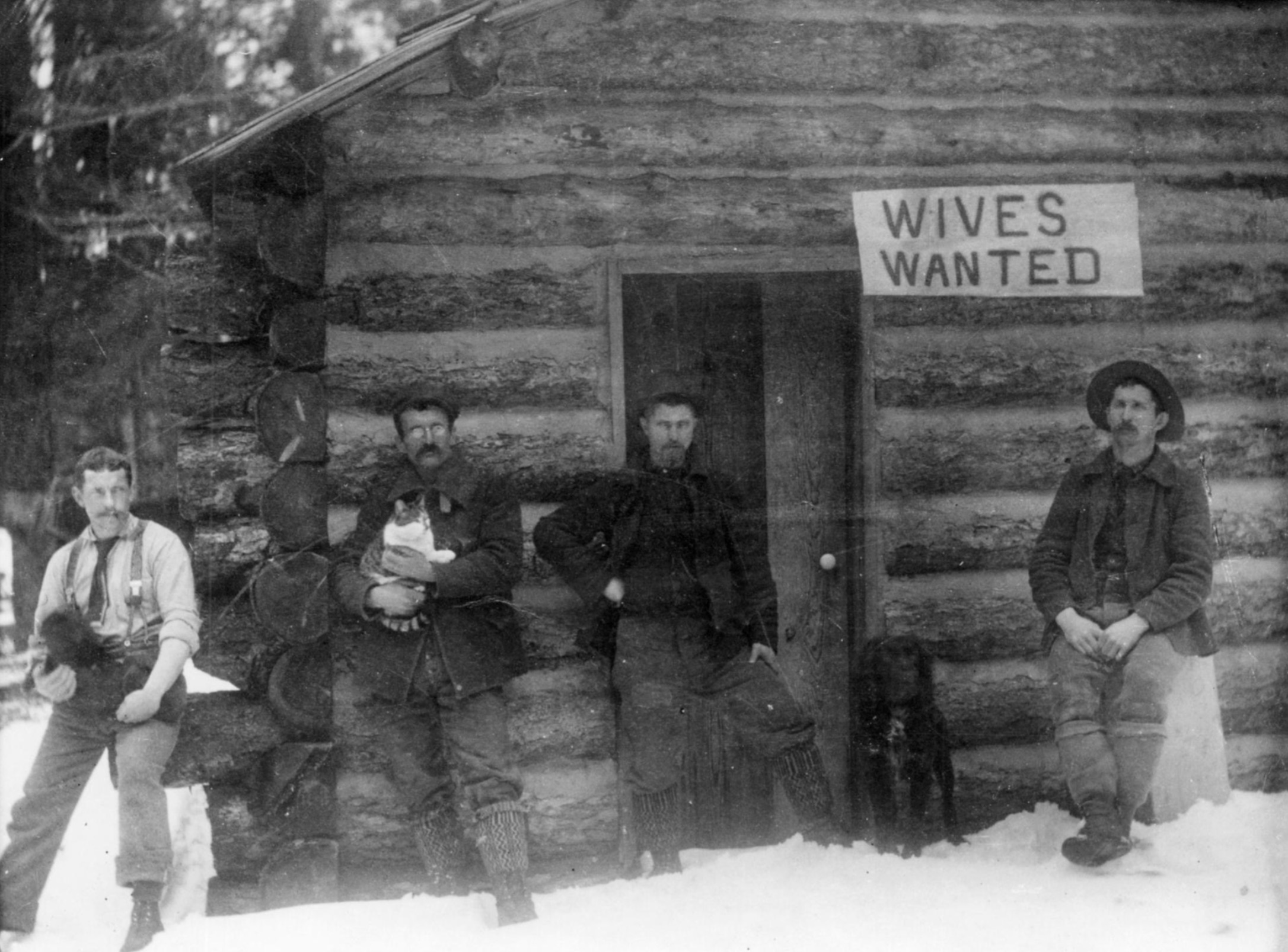 A group of frontiersmen with an advertisement. Montana, 1901